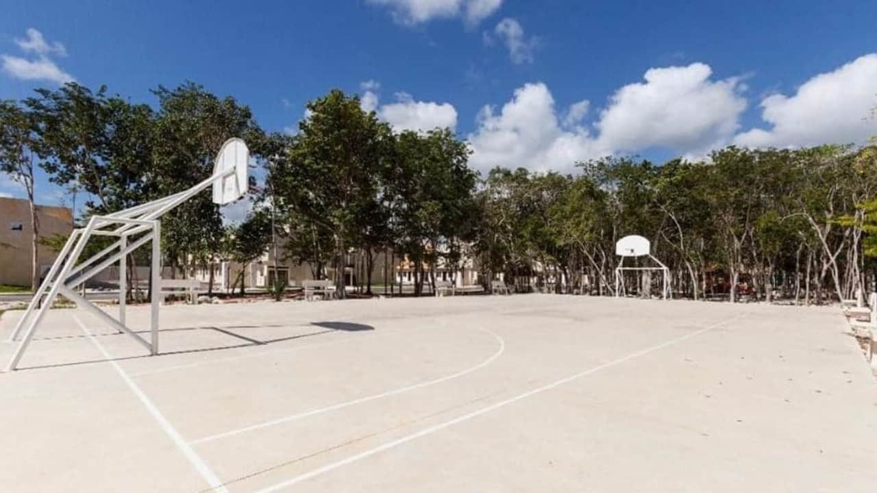 Football and basketball court surrounded by park at Real Amalfi