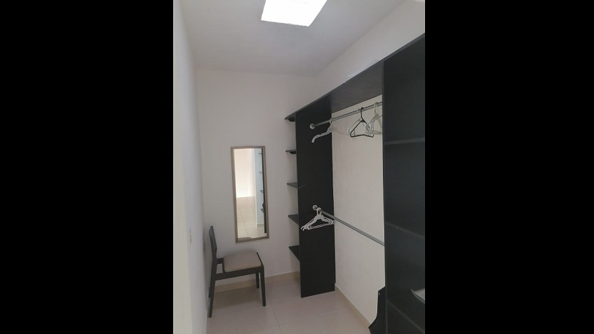 Closet with black wall furniture at Playa Azul