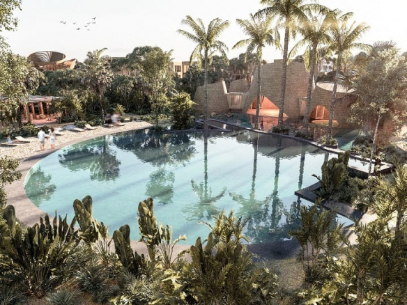 Large Round pool surrounded by vegetation at Aflora Tulum