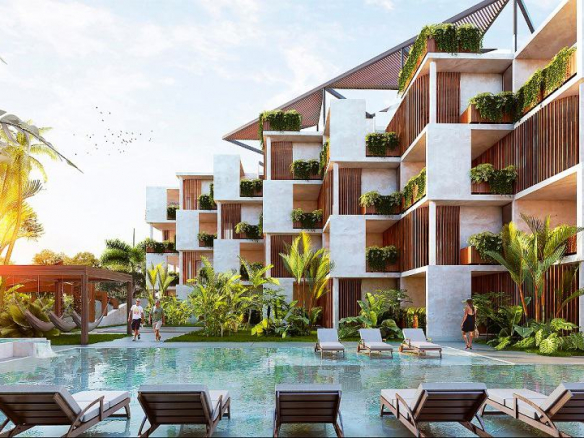 Swimming pool with solarium located next to residential building covered with plants and a woman walking at Inuk