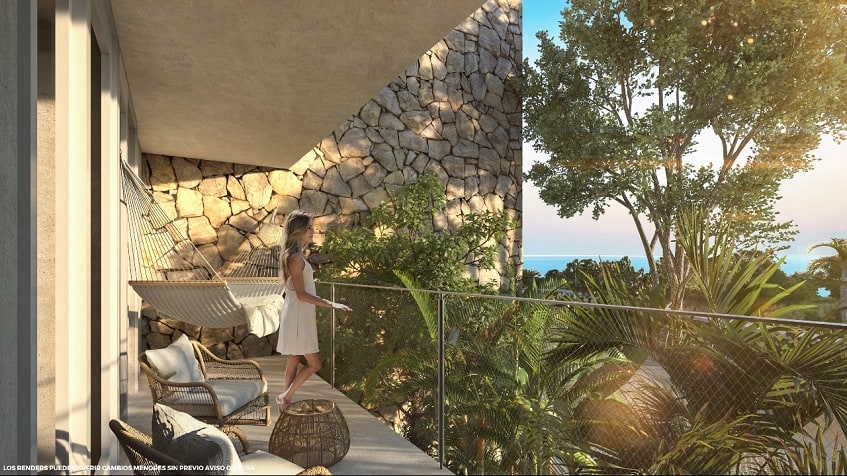 Balcony terrace with hammock and a woman looking at the garden at Santamar Akumal