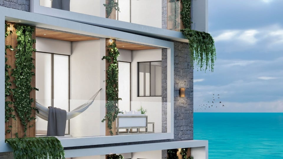 Balcony terraces view with hammock or a small table and oceanview at Xkaa Ocean View Condos