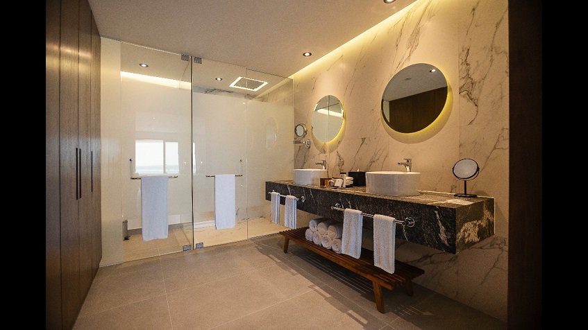 Bathroom with double sink, double shower at The Fives Oceanfront