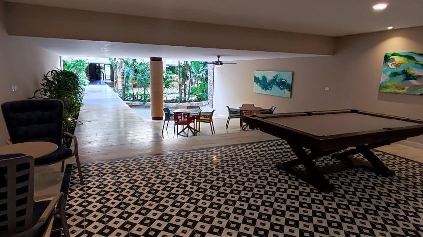 Pool table and sitting area in a large open space room at Syrena Studio Living