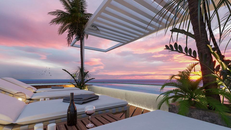 Rooftop pool and solarium at Xkaa Ocean View Condos