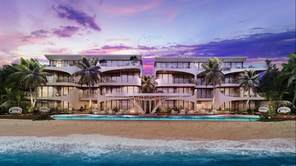 Residential building facade in front of the ocean and the beach at Tankah 52
