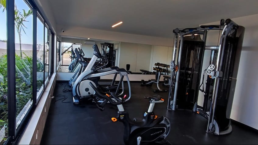 Gym with window and garden view at Syrena Studio Living