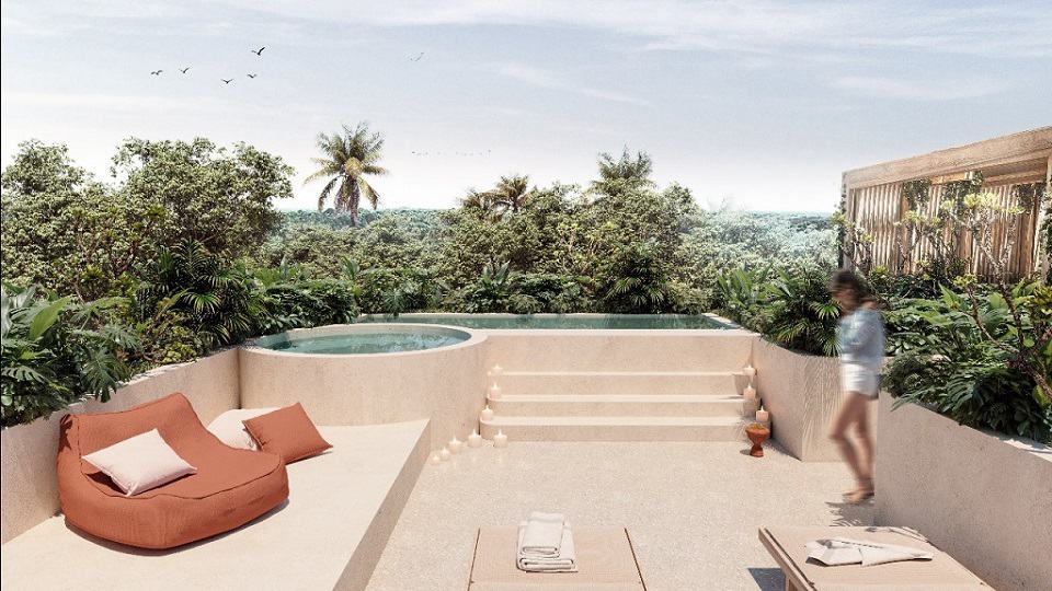 Jungle view penthouse terrace with pool and jacuzzi and a woman standing at Aflora Tulum