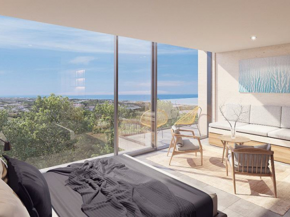 Bedroom with a terrace and large window that have garden and ocean view at Kaab at the South Beach