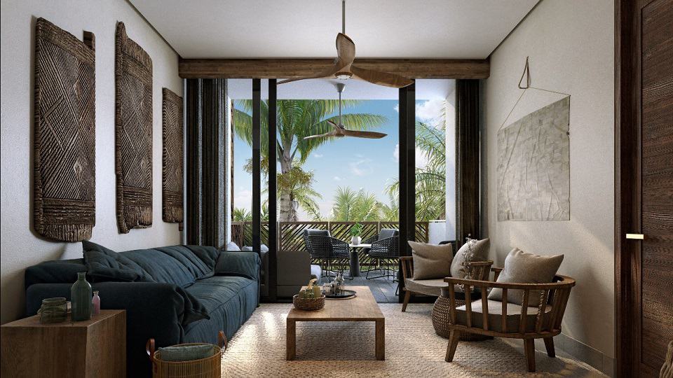 Condo interior with blue sofa and round small table on the terrace at Amana Tulum