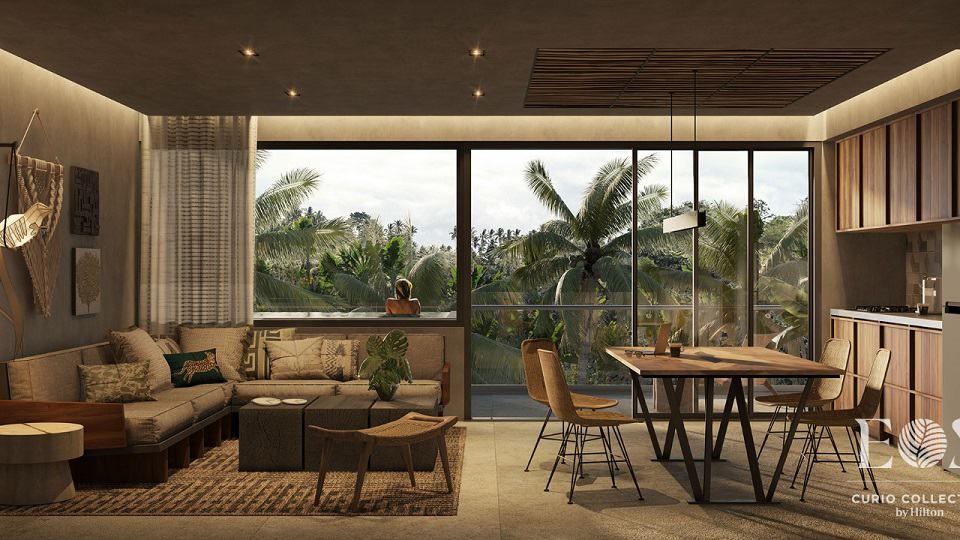 Condo interior with a wall glass and pool terrace at Eos Tulum