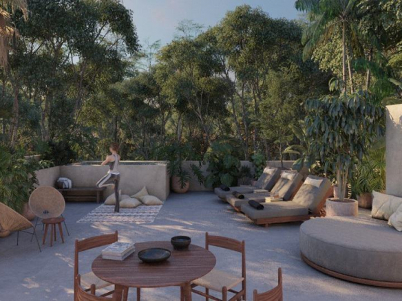 Lounge area surrounded by the garden and woman doing yoga at Koh Apartments