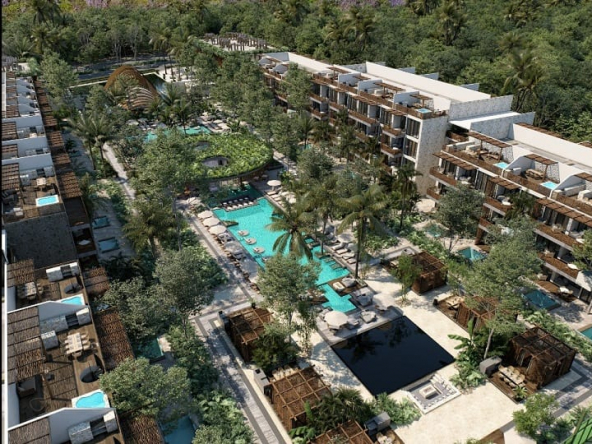 Condominium residential with two large pools and recreation areas in the middle at Amana Tulum