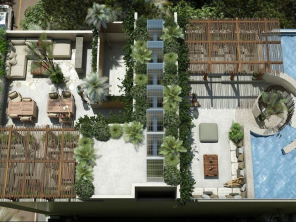 Top view of a rooftop with a pool and lounge area at Blanko Living