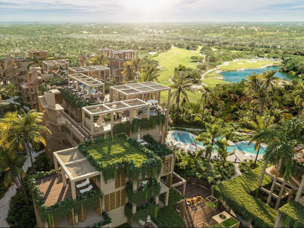 View of residential condominium with a pool surrounded by golf course at The Village Residence