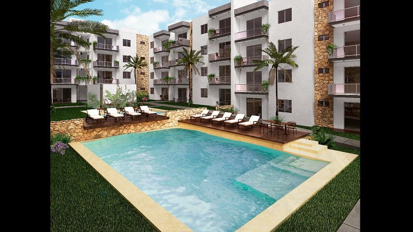 Pool and sundeck in the middle of condominium residential at Lu'xia Residencial