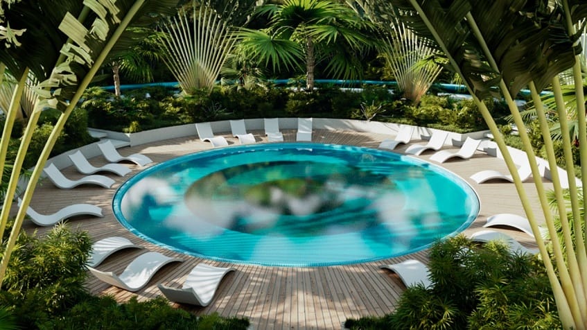 Cenote Shaped pool with sunbeds surrounded by the jungle at Taema Residential
