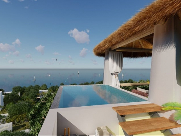 Rooftop pool, palapa and ocean view at Nativo Cozumel