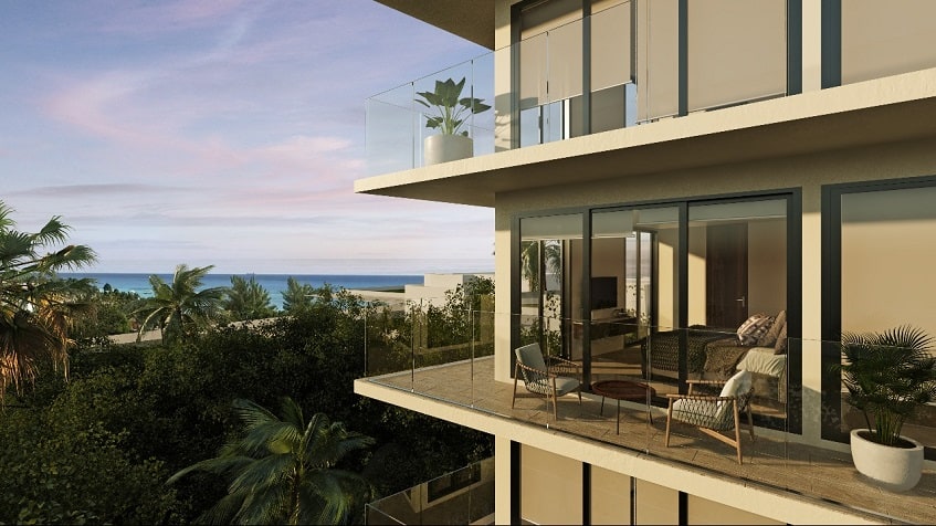 Top balconies facade of the residential building and oceanview at Marila