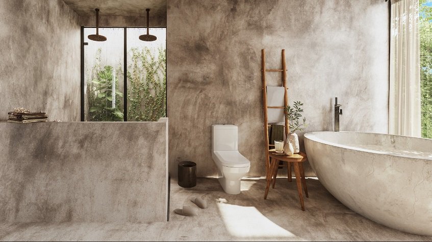 Bathroom with two shower heads and big bathtub in the grey wall of Mar y Miel Tulum