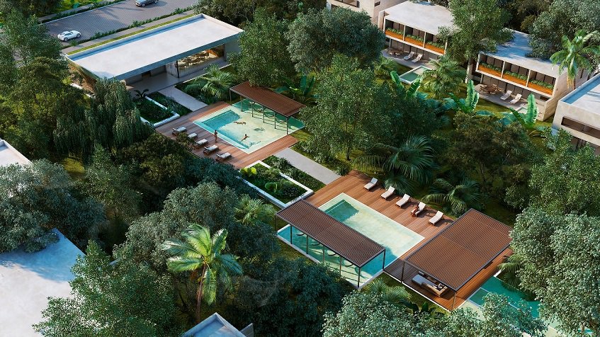 House club and two swimming pools, solarium and pergolas at Xpu-Ha Beach Residential Resort