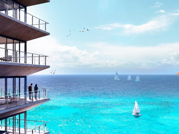 Residential building facade with balconies and a couple watching boats on the ocean at The Maria Cozumel