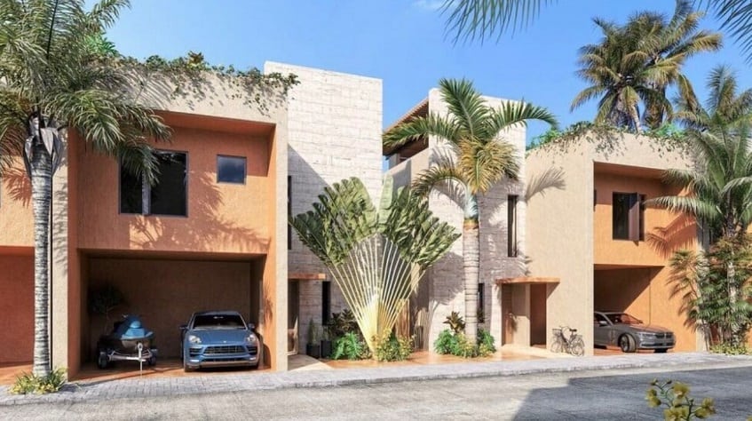 White and orange facade of houses with large car garage at Aleda Playa