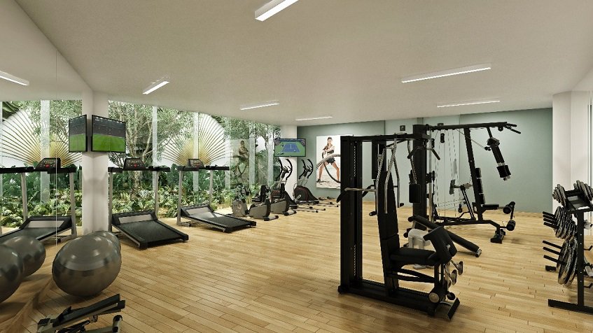 Gym room with many exercise tools in front of the garden at Marila