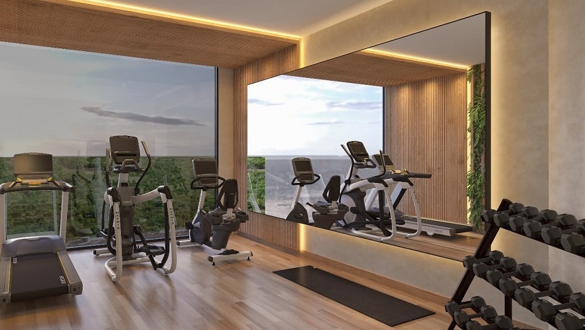 Gym room with jungle view and mirror at Novara Elevated Living