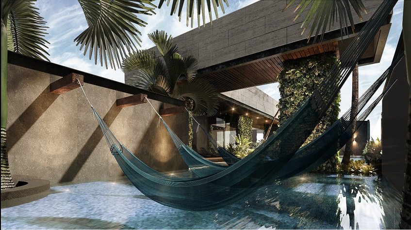 Swimming pool and hammocks hanging over it at Sofia Boutique Condos