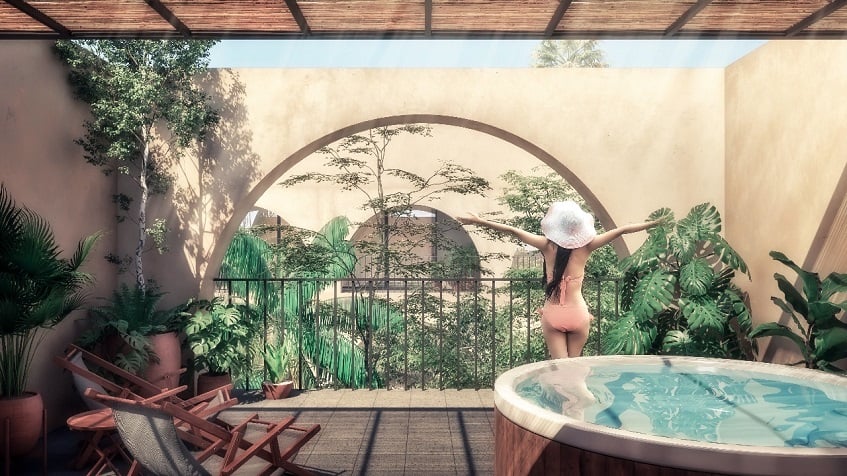 Jacuzzi on the terrace and a woman watching a garden with extended hands at Yaxche Apartments