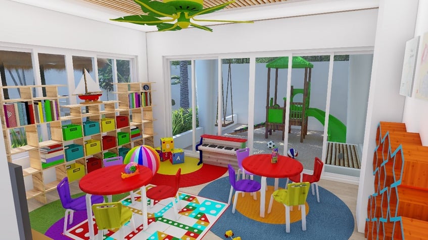 Colorful kids club with small tables, chairs and wooden shelves with boxes at Nativo Cozumel