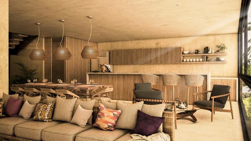 Penthouse with cushions sofa and kitchen at Ophelia Tulum