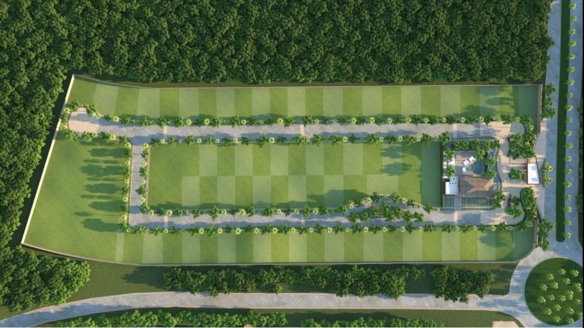 Top view of residential land lots area with a gate entrance at Xaman Ha