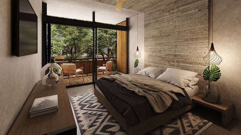 Bedroom with double bed and terrace at Irie Tulum