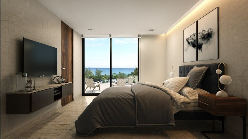 Oceanview bedroom and bed in front of tv screen at Marila