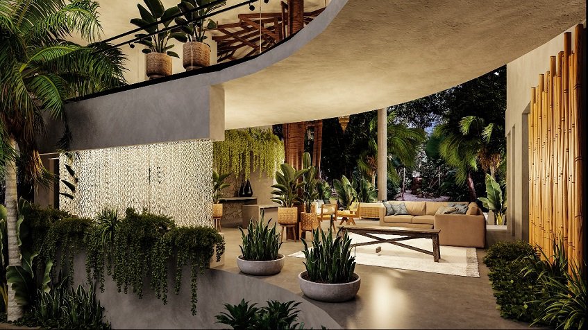 Lobby with sofas and waterfall decor surrounded by plants at Kikaab Tulum