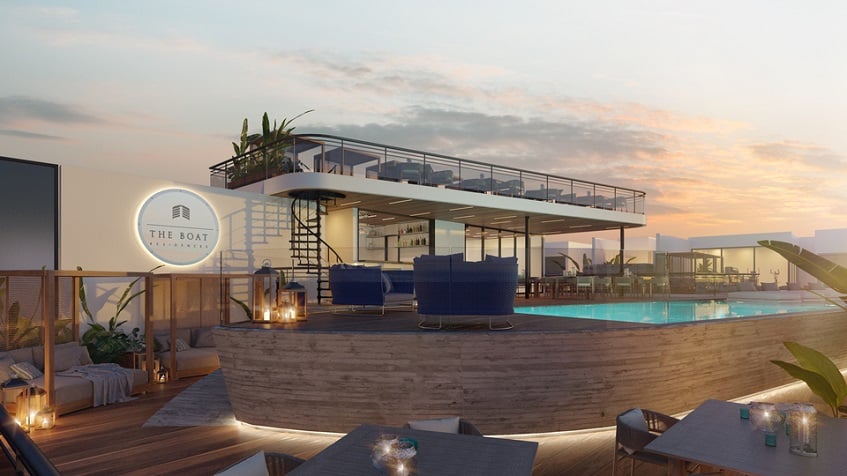 Rooftop swimming pool with lounge area at The Boat Residence