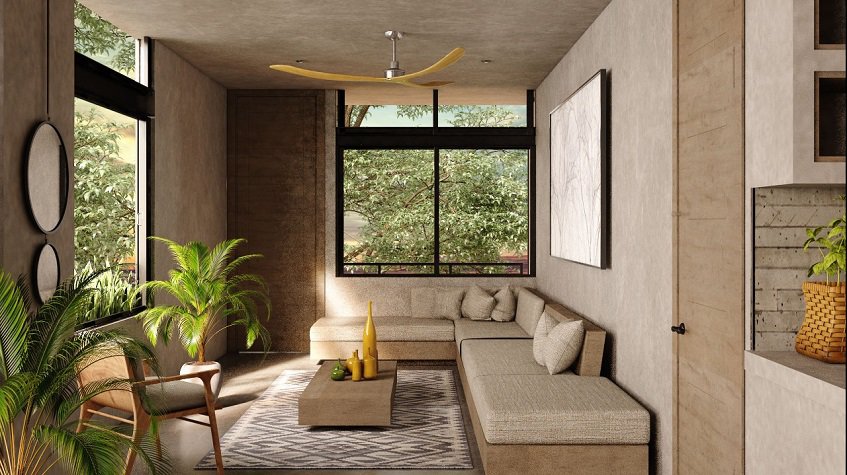 Living room with white sofa corner and two windows at Irie Tulum