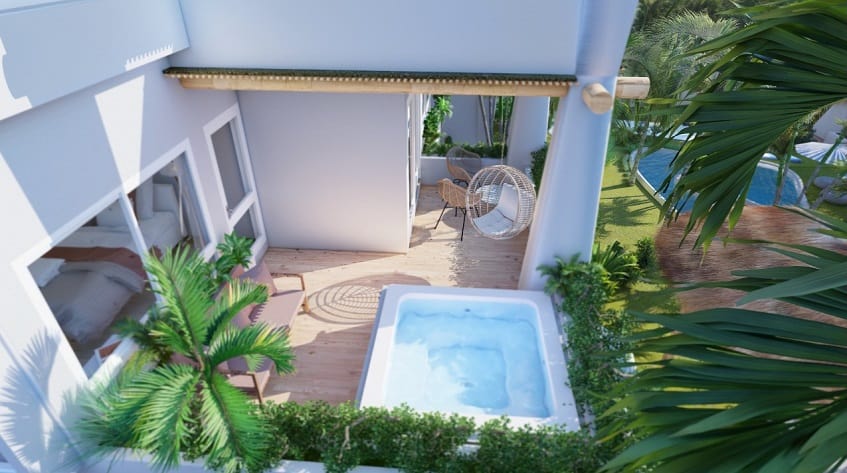 Private terrace with jacuzzi and pool surrounded by vegetation at Nativo Cozumel