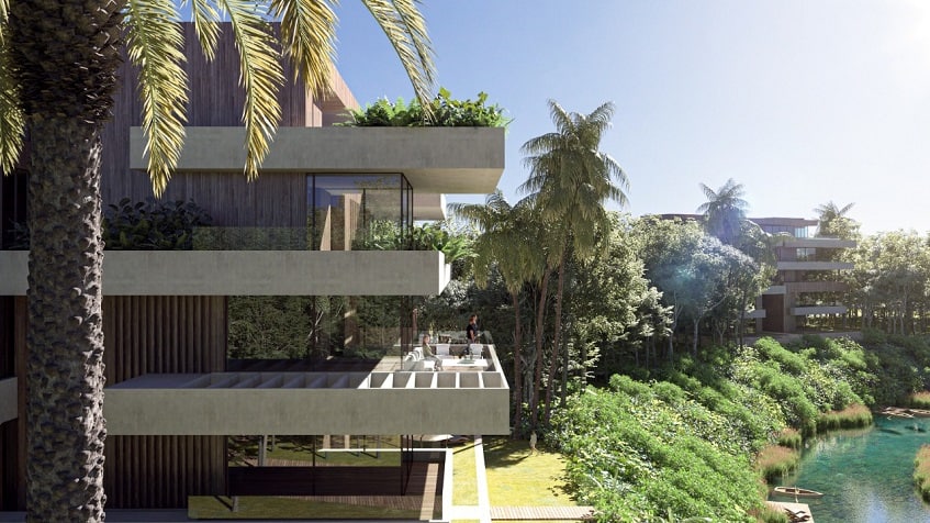 Two residential buildings facades with terraces and view for the river at Reserve at Mayakoba
