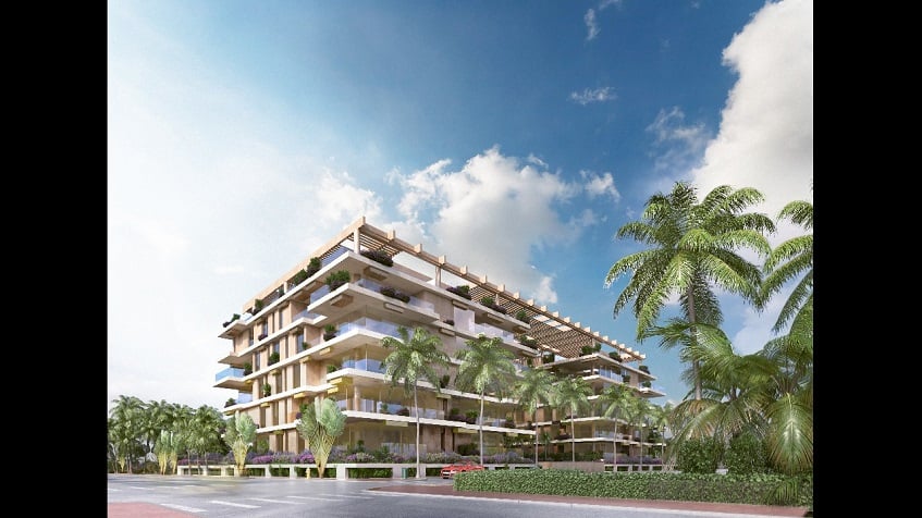 Corner view of white residential building surrounded by vegetation at Alba Marina