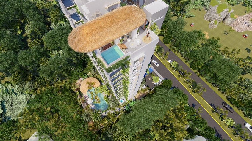 Top view of residential building with rooftop pool, ground floor pool and palapas at Nativo Cozumel