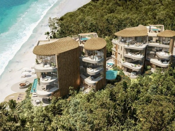 Two tall residential building by the beach at Naomi Beach Villas