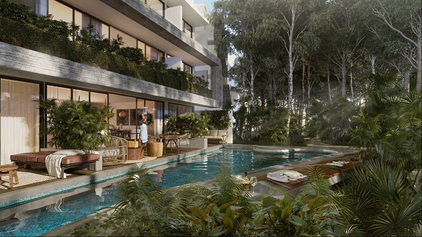 Private terraces in front of the long pool at 101 Park Tulum