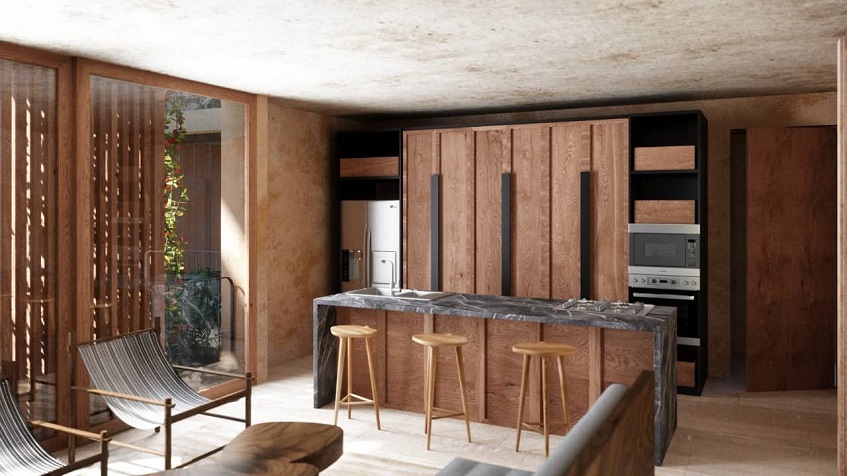Kitchen with breakfast bar with wooden finishes and decor at Faisano Tulum