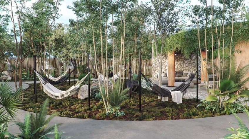 Garden with six black and white hammocks at Aldea Savia