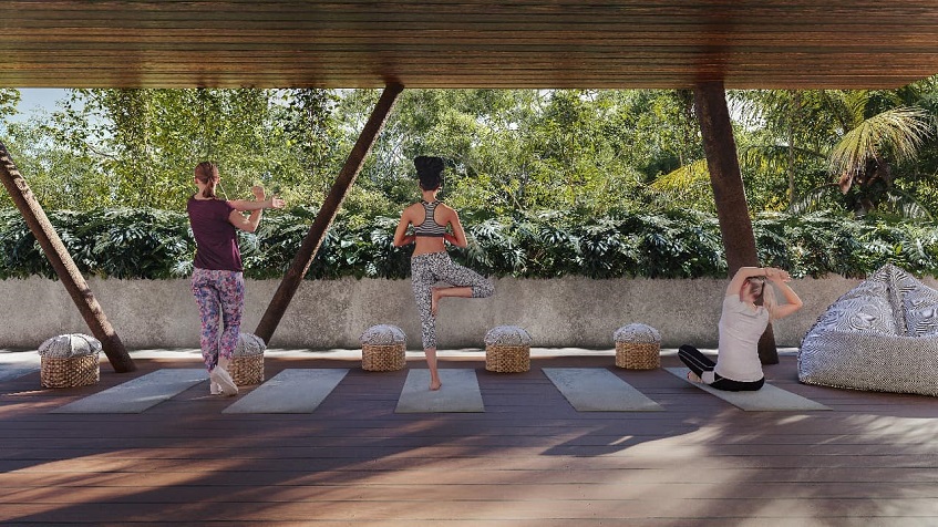 Open door yoga area with three women doing exercise at Xibalba Tulum
