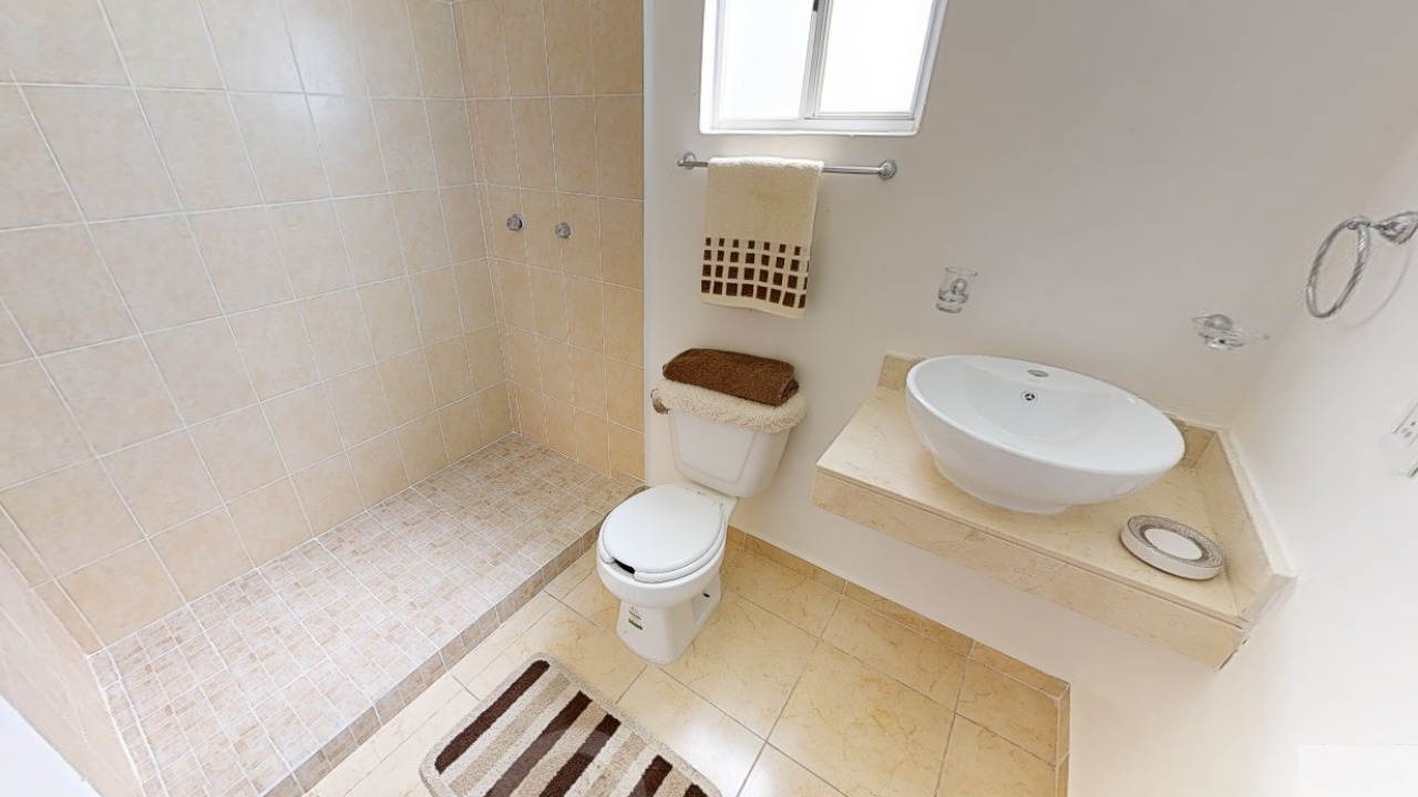 White bathroom with a shower at Bonanova