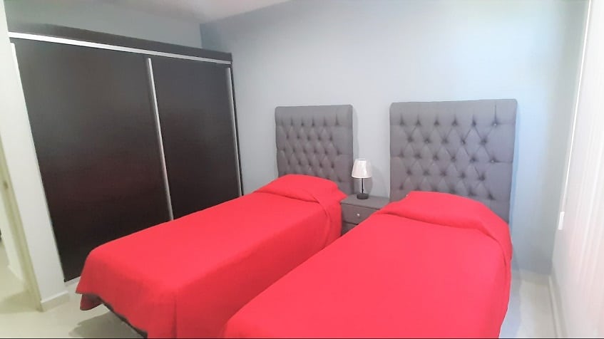 Bedroom with two single beds at Riviera Towers 2